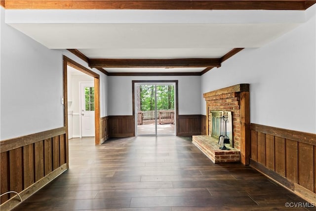 3401 Quail Hill Dr, Chesterfield, VA 23112 - unfurnished living room featuring a wainscoted wall, beam ceiling, dark wood-type flooring, a fireplace, and crown molding