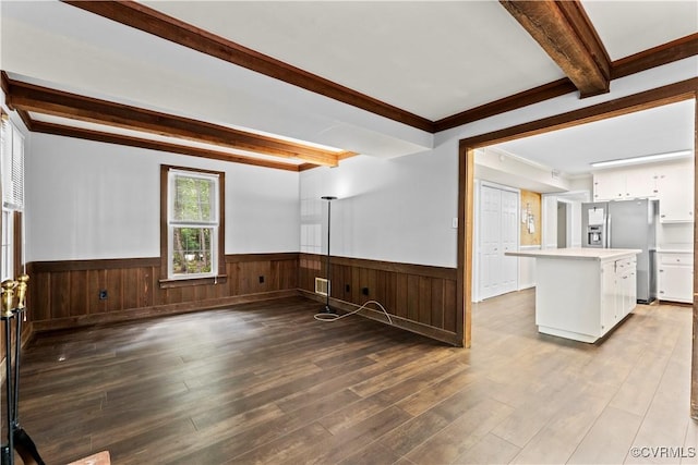 3401 Quail Hill Dr, Chesterfield, VA 23112 - kitchen with beamed ceiling, stainless steel refrigerator with ice dispenser, white cabinetry, a wainscoted wall, and wood finished floors