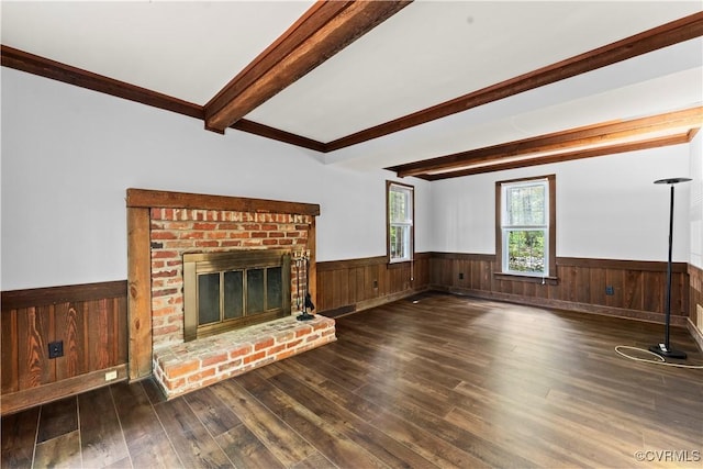 3401 Quail Hill Dr, Chesterfield, VA 23112 - unfurnished living room with a wainscoted wall, wood finished floors, beamed ceiling, a brick fireplace, and wood walls