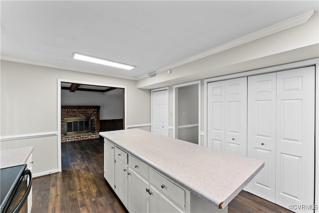 3401 Quail Hill Dr, Chesterfield, VA 23112 - kitchen featuring light countertops, black / electric stove, white cabinetry, ornamental molding, and dark wood-style floors