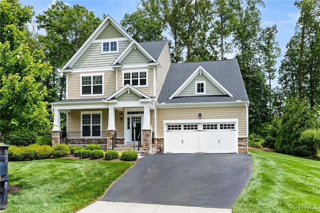 1013 Fernview Trl, Midlothian, VA 23114 - craftsman-style house with an attached garage, driveway, stone siding, a porch, and a front yard