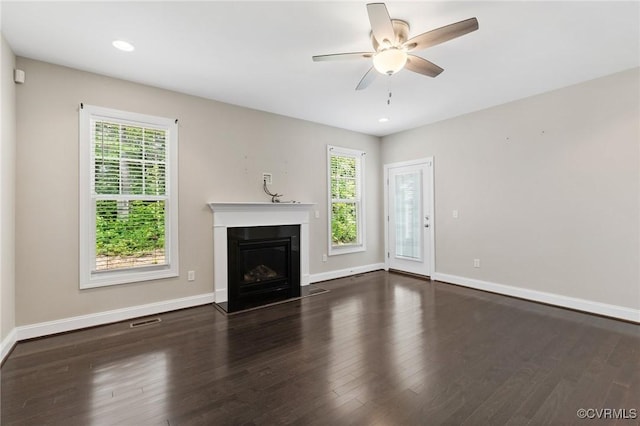 1013 Fernview Trl, Midlothian, VA 23114 - unfurnished living room with plenty of natural light, a ceiling fan, wood finished floors, a glass covered fireplace, and recessed lighting