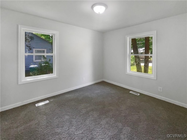 943 Barlen Dr, Richmond, VA 23225 - spare room featuring dark colored carpet and baseboards