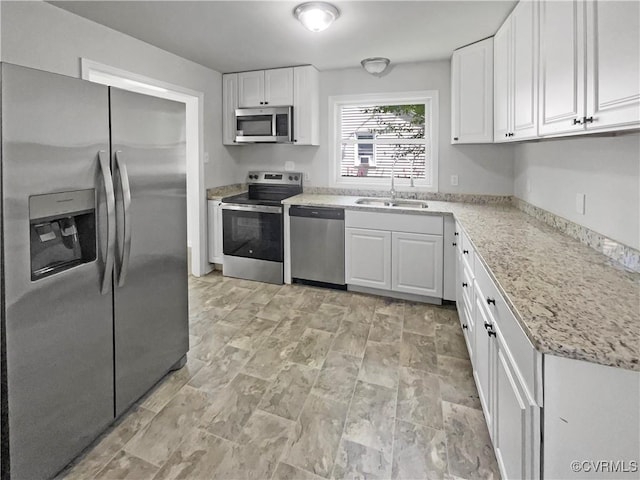 943 Barlen Dr, Richmond, VA 23225 - kitchen featuring stainless steel appliances, white cabinetry, and light stone countertops