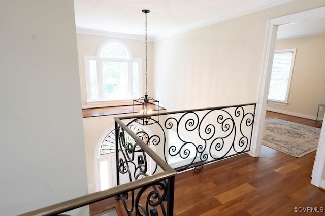 9307 Oak Trl, Ashland, VA 23005 - hallway featuring crown molding, dark wood-type flooring, and an upstairs landing