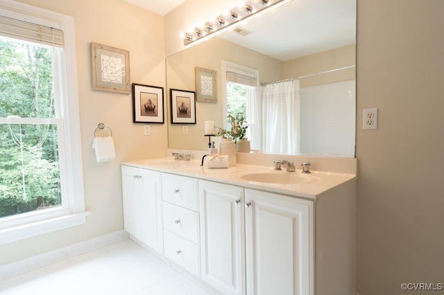 9307 Oak Trl, Ashland, VA 23005 - full bathroom with double vanity, healthy amount of natural light, and curtained shower