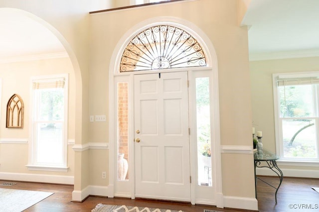 9307 Oak Trl, Ashland, VA 23005 - foyer with arched walkways, plenty of natural light, wood finished floors, and ornamental molding