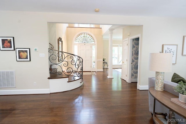 9307 Oak Trl, Ashland, VA 23005 - entrance foyer with ornate columns, wood finished floors, and stairway