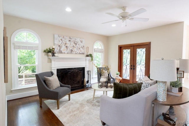 9307 Oak Trl, Ashland, VA 23005 - living area with wood finished floors, a fireplace with flush hearth, french doors, a ceiling fan, and recessed lighting