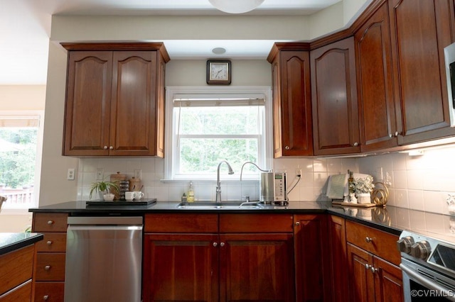 9307 Oak Trl, Ashland, VA 23005 - kitchen featuring appliances with stainless steel finishes, dark countertops, and tasteful backsplash