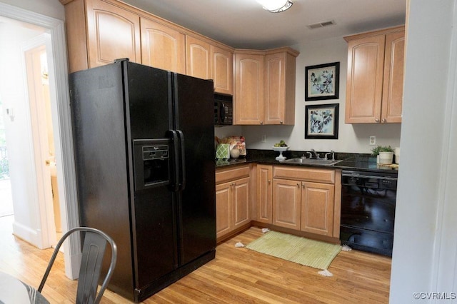 9307 Oak Trl, Ashland, VA 23005 - kitchen featuring black appliances, light wood-style floors, and light brown cabinets
