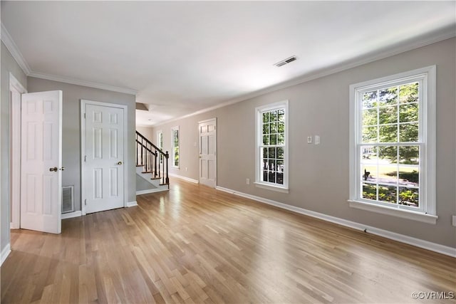 4605 Kingsrow Ct, Glen Allen, VA 23060 - spare room featuring light wood-style flooring, stairway, plenty of natural light, and crown molding