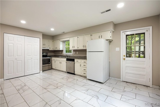 4605 Kingsrow Ct, Glen Allen, VA 23060 - kitchen with stainless steel appliances, light marble finish floors, recessed lighting, dark countertops, and white cabinets