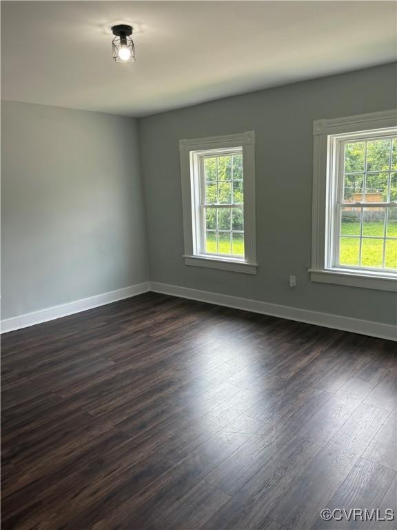 924 Lee Ave, Petersburg, VA 23803 - empty room with baseboards and dark wood-type flooring