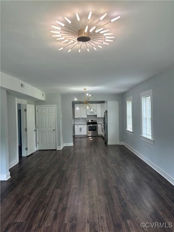 924 Lee Ave, Petersburg, VA 23803 - unfurnished living room featuring a chandelier and dark wood-style flooring