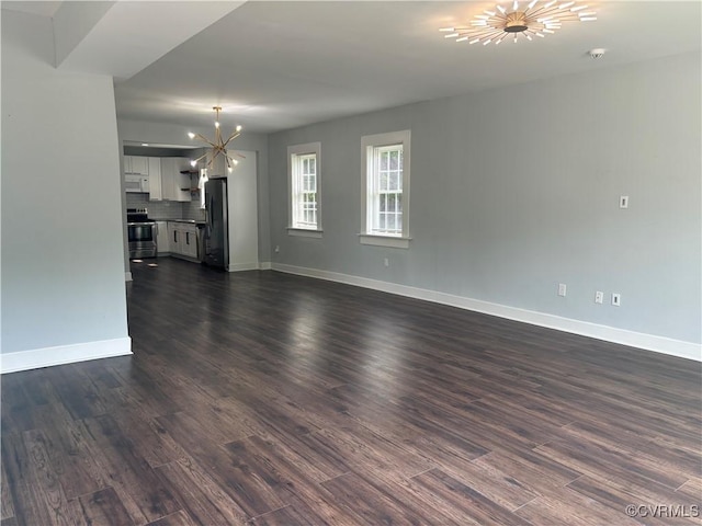 924 Lee Ave, Petersburg, VA 23803 - unfurnished living room with a chandelier and dark wood finished floors