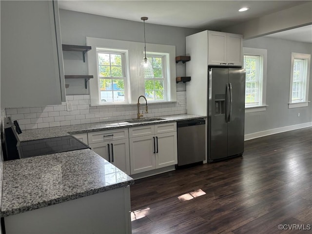 924 Lee Ave, Petersburg, VA 23803 - kitchen with open shelves, appliances with stainless steel finishes, light stone counters, white cabinetry, and recessed lighting