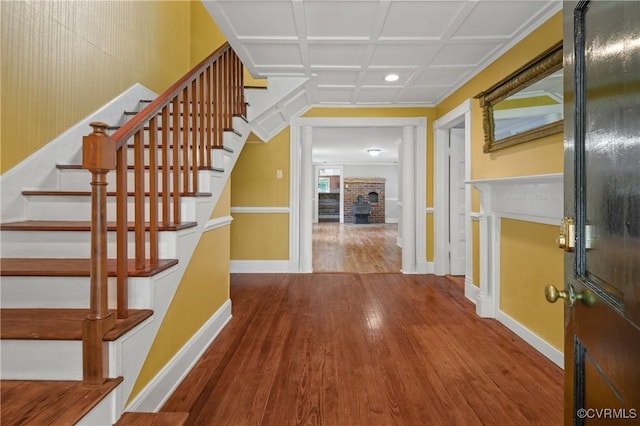 2644 Dorrell Rd, Aylett, VA 23009 - foyer with wood-type flooring, stairs, a brick fireplace, coffered ceiling, and recessed lighting