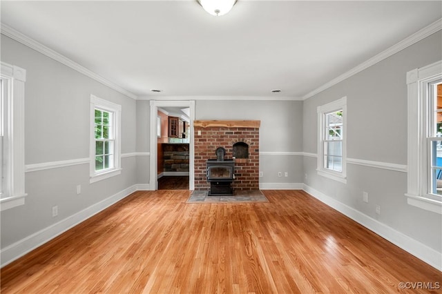 2644 Dorrell Rd, Aylett, VA 23009 - unfurnished living room with light wood-type flooring, ornamental molding, and a wood stove