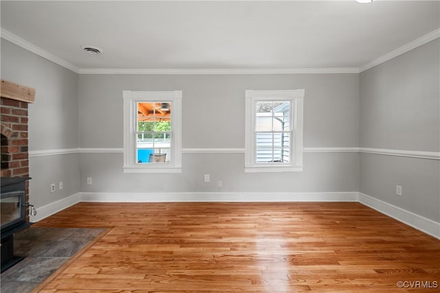 2644 Dorrell Rd, Aylett, VA 23009 - unfurnished living room with a wood stove, wood finished floors, and ornamental molding