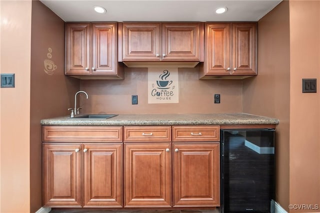 2644 Dorrell Rd, Aylett, VA 23009 - kitchen with wine cooler, recessed lighting, light countertops, and brown cabinetry