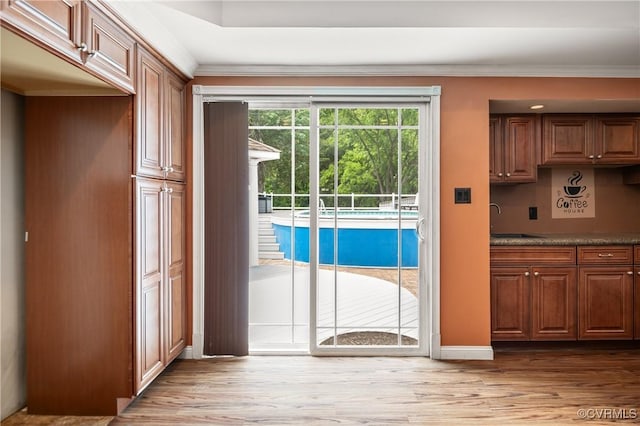 2644 Dorrell Rd, Aylett, VA 23009 - doorway featuring light wood-style flooring and ornamental molding