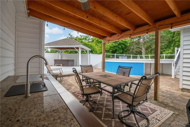 2644 Dorrell Rd, Aylett, VA 23009 - view of patio / terrace with a covered hot tub, a ceiling fan, outdoor dining space, and a gazebo