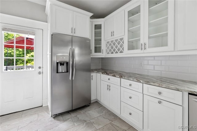 2805 Griffin Ave, Richmond, VA 23222 - kitchen featuring stainless steel fridge with ice dispenser, white cabinets, backsplash, light stone counters, and glass insert cabinets