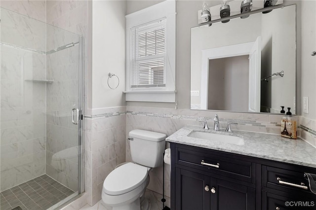 2805 Griffin Ave, Richmond, VA 23222 - bathroom featuring vanity, a stall shower, tile walls, and a wainscoted wall