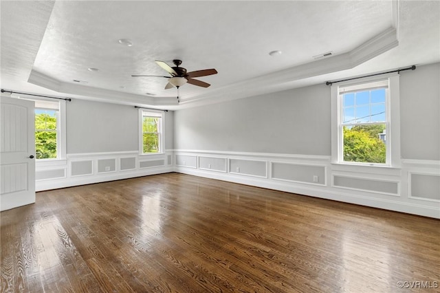 2805 Griffin Ave, Richmond, VA 23222 - spare room with a tray ceiling, ceiling fan, wood finished floors, crown molding, and a wainscoted wall