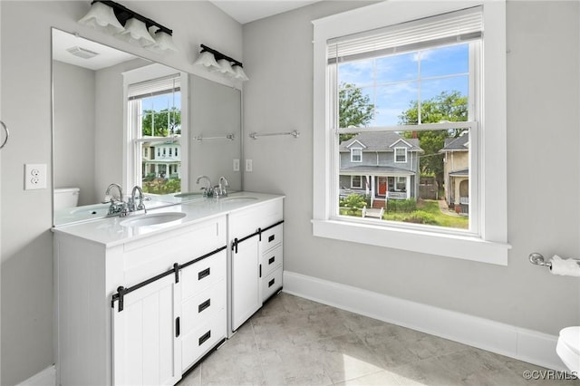 2805 Griffin Ave, Richmond, VA 23222 - bathroom with baseboards and double vanity