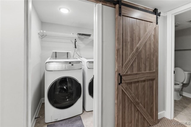 2805 Griffin Ave, Richmond, VA 23222 - washroom featuring a barn door and washer and clothes dryer