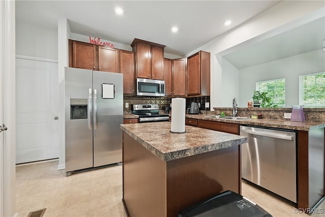 9206 Clovis St, Chesterfield, VA 23237 - kitchen with appliances with stainless steel finishes, decorative backsplash, a center island, recessed lighting, and light tile patterned floors