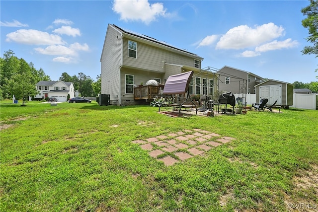 9206 Clovis St, Chesterfield, VA 23237 - rear view of house featuring a storage shed, a yard, a deck, crawl space, and a patio