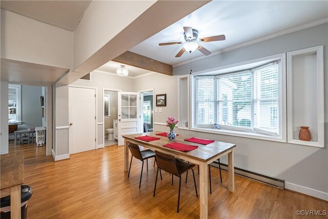 5013 Caledonia Rd, Richmond, VA 23225 - dining room featuring a baseboard heating unit, light wood-style floors, a ceiling fan, ornamental molding, and beam ceiling