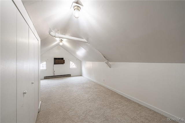 5013 Caledonia Rd, Richmond, VA 23225 - additional living space with a baseboard radiator, vaulted ceiling, carpet flooring, and a wall mounted AC