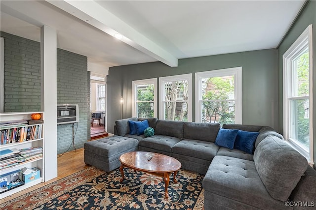 5013 Caledonia Rd, Richmond, VA 23225 - living room featuring healthy amount of natural light, beamed ceiling, wood finished floors, and heating unit