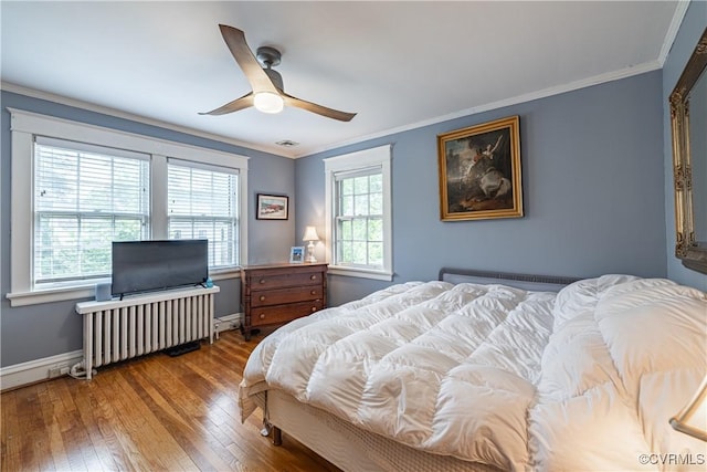 5013 Caledonia Rd, Richmond, VA 23225 - bedroom with hardwood / wood-style flooring, crown molding, radiator heating unit, and a ceiling fan