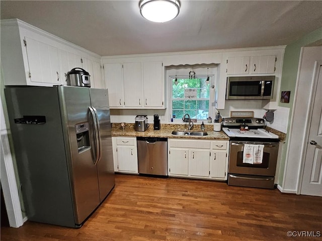 7106 Full Rack Dr, Midlothian, VA 23112 - kitchen with stainless steel appliances, white cabinets, and dark wood-style flooring