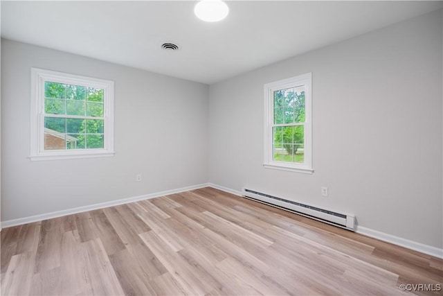 14410 Ranger Rd, Chesterfield, VA 23838 - empty room featuring a baseboard heating unit and light wood finished floors