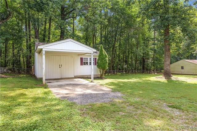 14410 Ranger Rd, Chesterfield, VA 23838 - view of outdoor structure with a carport, driveway, and a view of trees