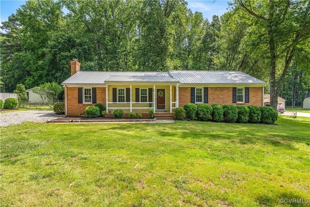 14410 Ranger Rd, Chesterfield, VA 23838 - single story home featuring a porch, a chimney, brick siding, and a metal roof