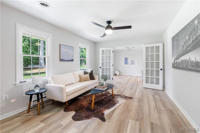 14410 Ranger Rd, Chesterfield, VA 23838 - living area with french doors, wood finished floors, a ceiling fan, and a baseboard radiator