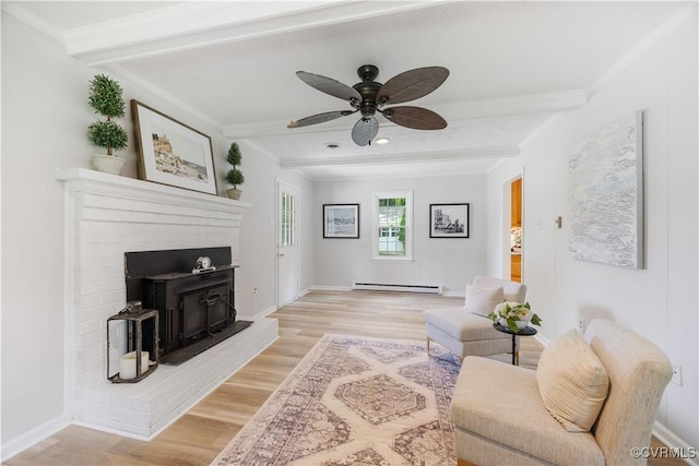 14410 Ranger Rd, Chesterfield, VA 23838 - living room with a baseboard radiator, beam ceiling, light wood-style flooring, ceiling fan, and a brick fireplace