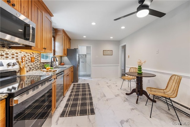 14410 Ranger Rd, Chesterfield, VA 23838 - kitchen featuring stainless steel appliances, tasteful backsplash, brown cabinets, ceiling fan, and recessed lighting