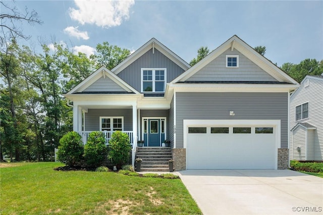 100 Heron Run Dr, Colonial Heights, VA 23834 - craftsman-style house with stone siding, a front yard, driveway, and an attached garage