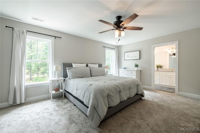 100 Heron Run Dr, Colonial Heights, VA 23834 - bedroom with light carpet, ensuite bath, and a ceiling fan