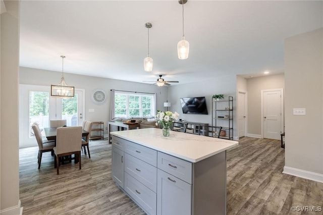 100 Heron Run Dr, Colonial Heights, VA 23834 - kitchen featuring gray cabinetry, a ceiling fan, light wood-style floors, light countertops, and open floor plan