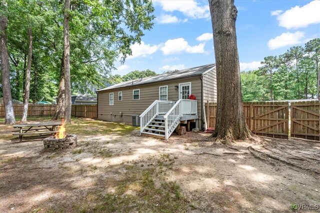 5908 Meadwood Cir, Chesterfield, VA 23234 - back of property with a fire pit and a fenced backyard