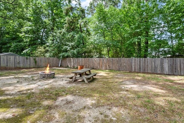 5908 Meadwood Cir, Chesterfield, VA 23234 - fenced backyard featuring a fire pit